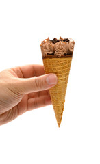 hand holding a fresh chocolate flavor ice cream cone on white with clipping path