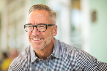 Mature handome fit man sitting outside stock photo