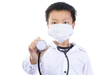 education and occupation concept. A asian boy wearing a self-protect mask and medical uniform holding stethoscope and looking at camera isolated on white. A boy wearing doctor's gown because dream job