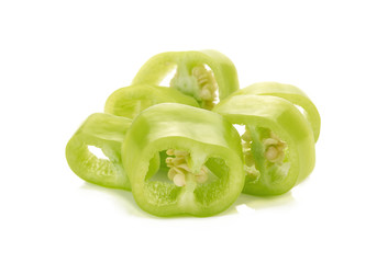 Sliced green chili peppers on a white background