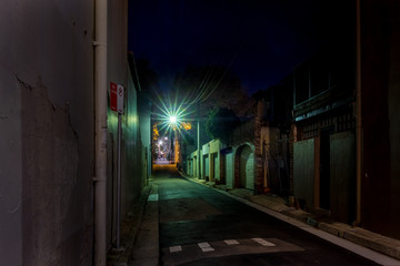 green light in ols street at night