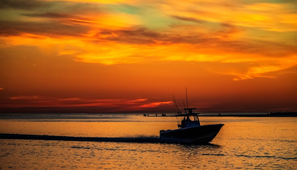 Naklejka premium boat at sunset, sea, ocean, water, sky, evening, landscape, travel, dusk, orange, silhouette, island