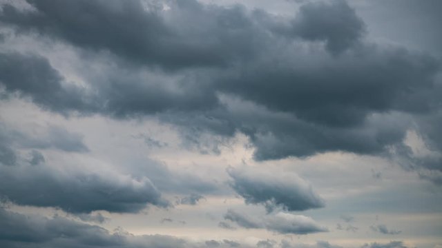 Clouds sky time lapse fast motion weather storm dramatic atmosphere. Nature landscape with dramatic gray cloudscape moving quickly 4K timelapse