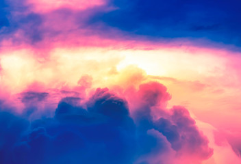 Obraz premium orange color light with pink neon light in overcast sky with deep blue clouds