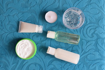 Naklejka premium Set of cosmetics for makeup on a turquoise background. The view from the top.