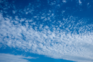 Blue sky with white and gray clouds
