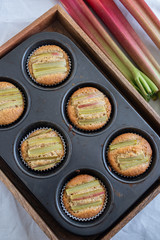 home made almond rhubarb muffins on a table
