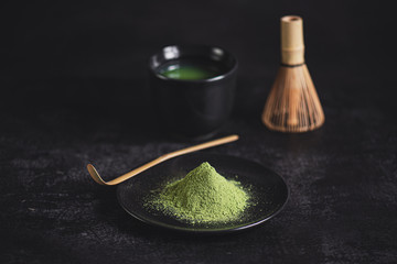 Japanese matcha tea  in bowl on black background