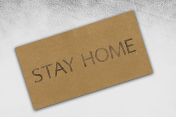 Illustration of a brown paper texture with text of stay home on vintage cardboard background