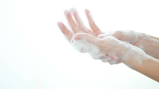 Hand washing with soap isolated on white background for clean hand hygiene.