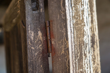 Ancient village wooden door metal hinge