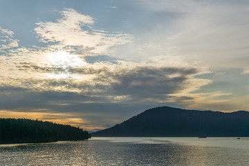 sunset Haro strait view from Vancouver island with cloudy sky British Columbia Canada.