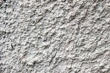 The surface of the fence is created by throwing cement and painted white.