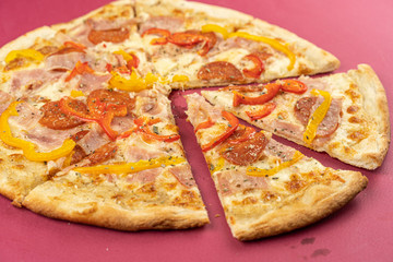 pizza close-up, isolated, against a colored background. whole pizza 