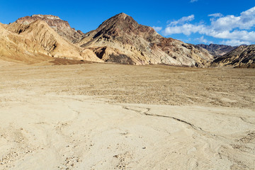 Death Valley expands toward distant peaks. In California.