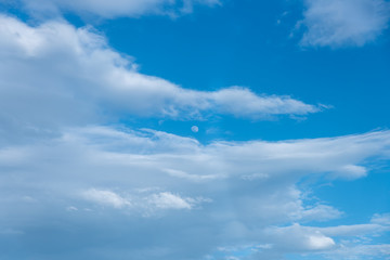 Blue sky with white and gray clouds