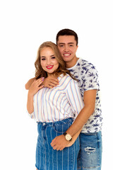 A guy embraces a beautiful juicy girl