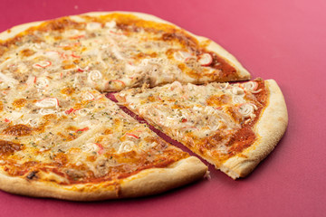 pizza close-up, isolated, against a colored background. whole pizza 