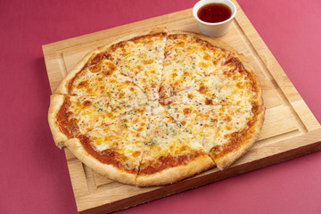 pizza close-up, isolated, against a colored background. whole pizza 