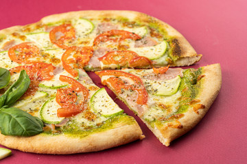 pizza close-up, isolated, against a colored background. whole pizza 