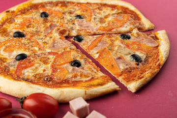 pizza close-up, isolated, against a colored background. whole pizza 