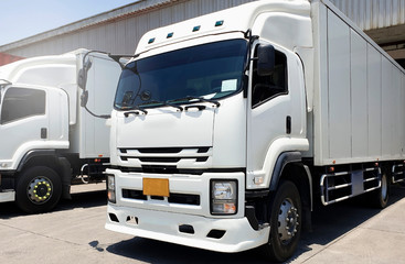 white truck docking at warehouse, truck loading, road freight cargo shipment transport