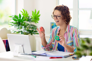 Online remote learning. Teacher with computer.