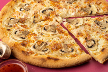 pizza close-up, isolated, against a colored background. whole pizza 