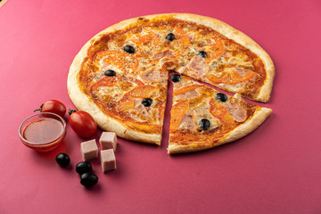 pizza close-up, isolated, against a colored background. whole pizza 