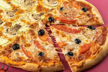 pizza close-up, isolated, against a colored background. whole pizza 