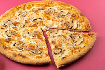 pizza close-up, isolated, against a colored background. whole pizza 