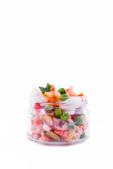 Olivier salad with shrimp in a jar on a white background