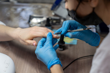 professional gamblet processing of nails by a manicurist