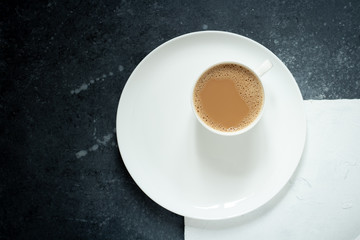 a Cup of coffee on a white grey background
