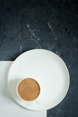 a Cup of coffee on a white grey background