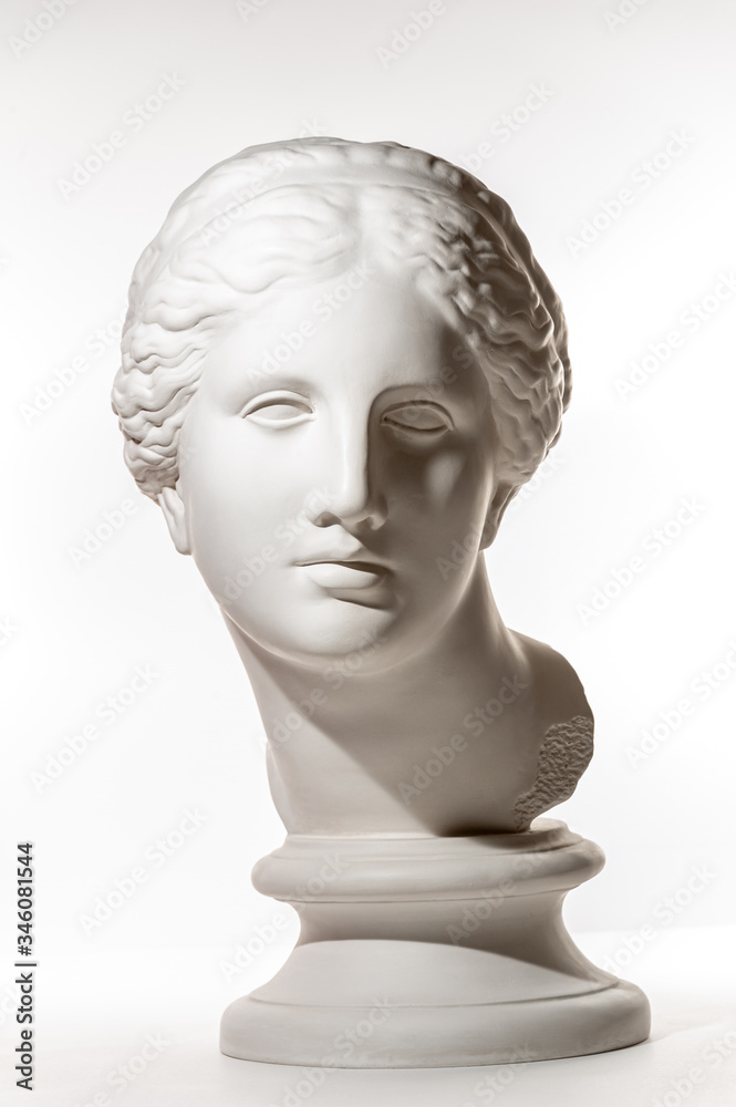 Wall mural gypsum copy of ancient statue venus head isolated on white background. plaster sculpture woman face.