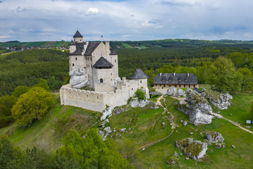 Aerial view of Castle Bobolice, one of the most beautiful fortresses on the Eagles Nests trail. Medieval fortress in the Jura region near Czestochowa. Poland.