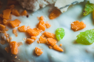 Orange and green pastry topping for decoration of Easter pastry, close-up, macro shot.
