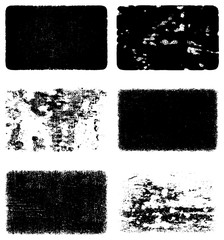 A set of grunge textures in black and white. Background of dust, scratches, cracks, debris. Abstract dark spots