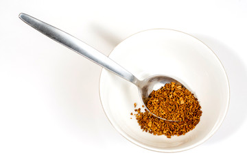 Coffee ground in stainless table and tea spoon