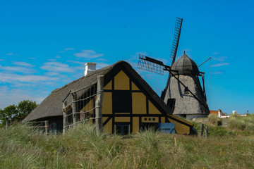 Plakat old windmill in skagen denmark with blue sky