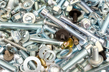 lots of metal bolts for construction and repair as a background