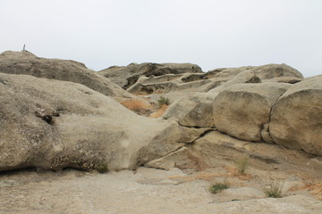 beige brown sand colored stones rocks in the city of Queen Tamara in the city of Vardzia