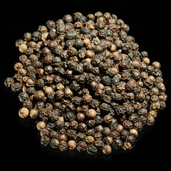 Whole peppercorn with black background.
