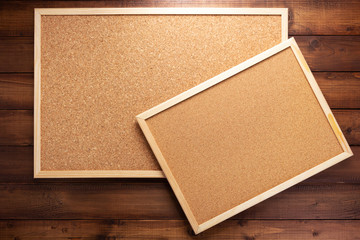 Fototapeta premium cork board on wooden background