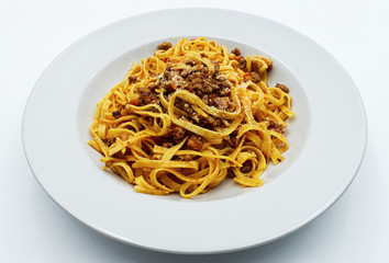 
Fettuccine with ragu bolognese and parmesan isolated on white. Italian pasta
