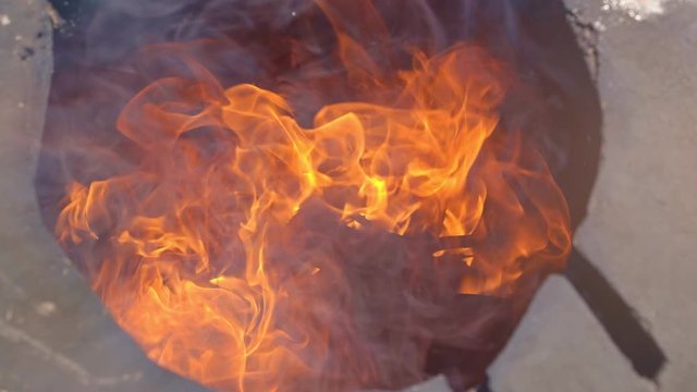 fire are burning inside aboveground tandir oven
