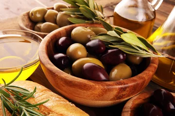 Foto op Plexiglas Olives. Bottle virgin olive oil and oil in a bowl with some green and black olives © beats_