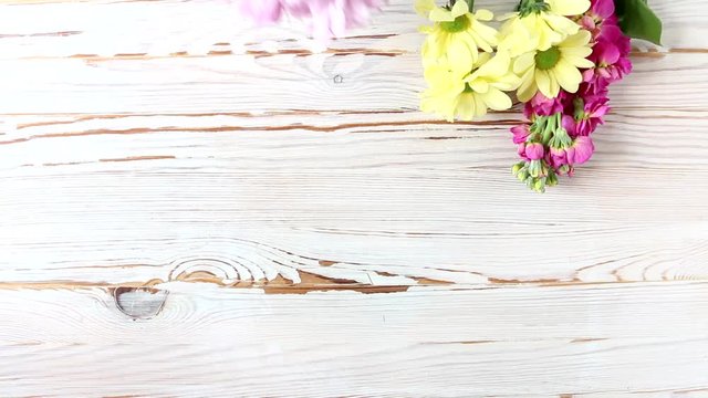 Beautiful flowers on wooden table, copy space.