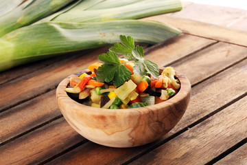 stir fried vegetables from a chinese wok in a bowl with carrot and mushrooms